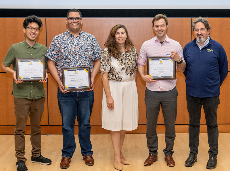 Derek Dang (left) receives 2023 Phyllis M. Wise Biomedical Sciences Graduate Student Award at the OGPS Award Ceremony (June 2023).