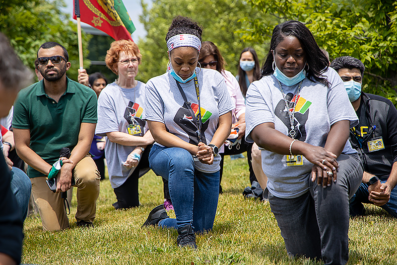 Participants in the kneeling.