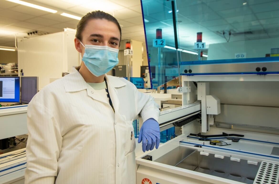 Medical Technologist Trisha Franklin poses with equipment used for COVID-19 testing in the Microbiology Lab.