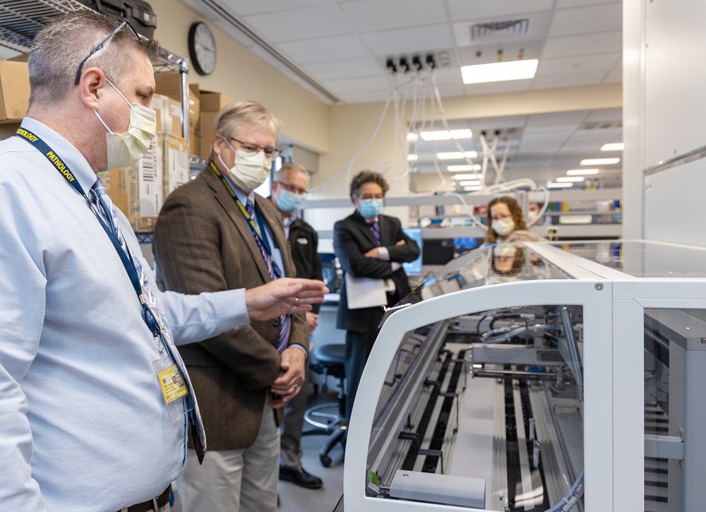 Eric Vasbinder (far-left) leading the tour and speaking about the new automation line.