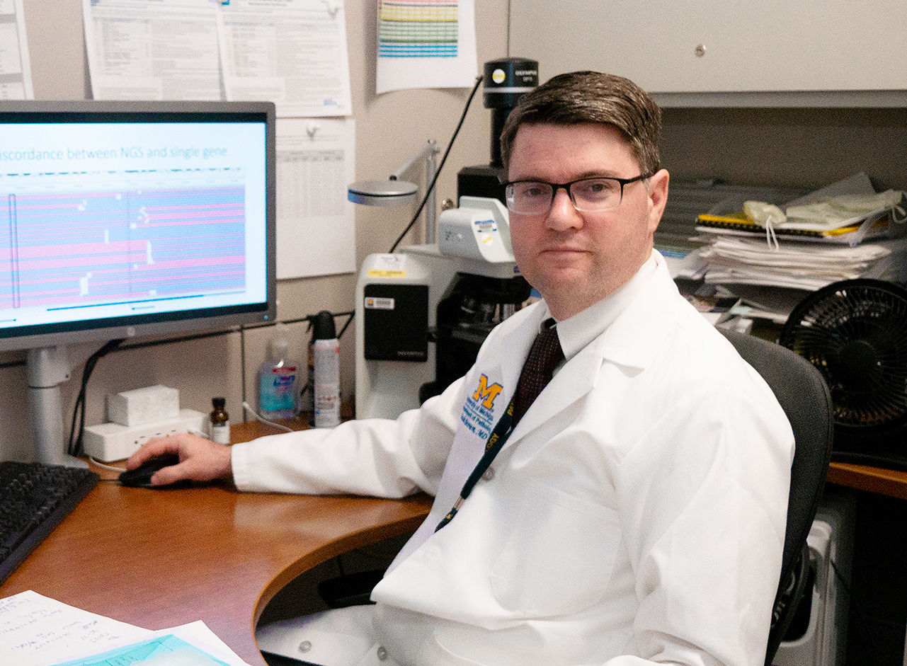 Dr. Noah Brown working at his desk.