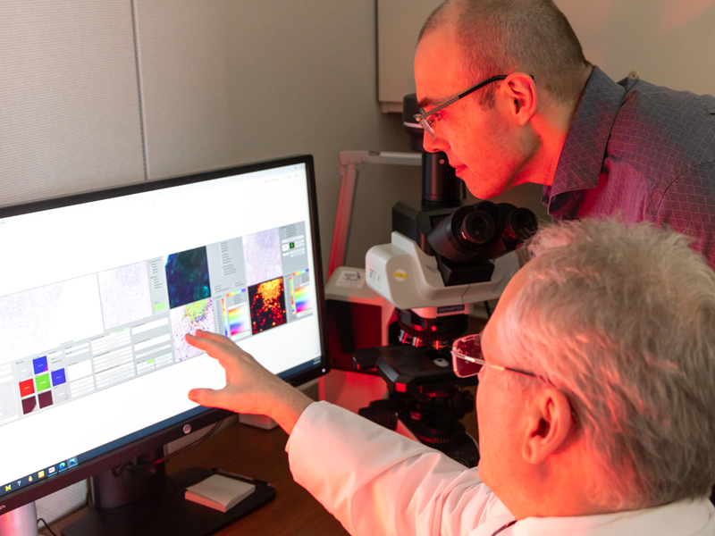 Dr. Pantanowitz (bottom) working alongside Operations Manager, Peter Ouillette.