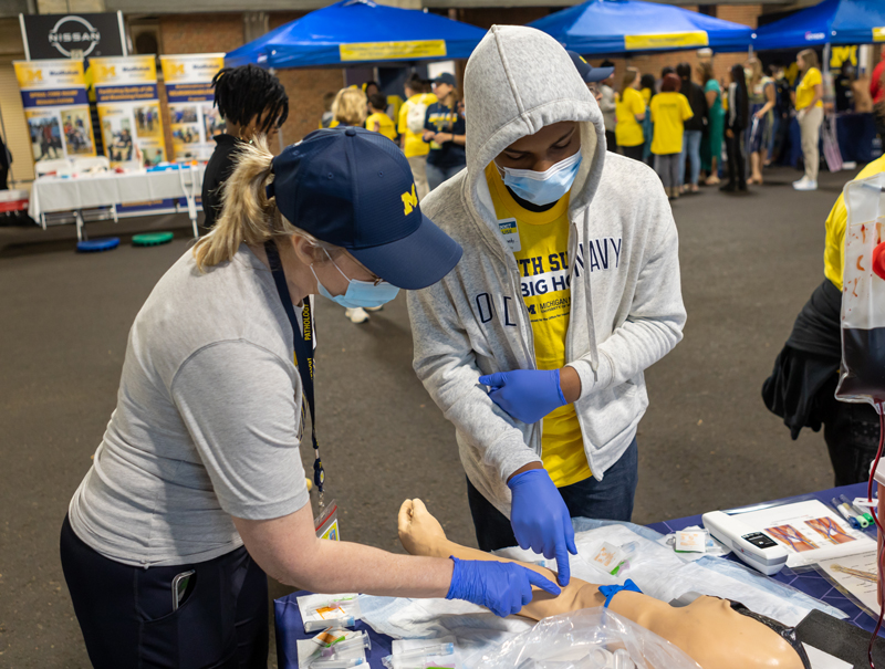 Karen Barron educating a student at the 2022 Youth Summit.