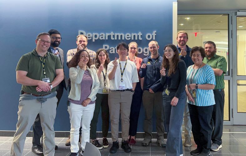 Back Row, L-R: Drs. Kamran Mirza, Kyle Conway, Emile Pinarbasi, Nicole Becker, Ryan Landvater, Ms. Kalleen Schwark, Mr. Gerson Gran; Front row, L-R: Drs. Sean Ferris, Sandra Camelo-Piragua, Truong Nguyen, Sara Stone, Ms. Marie Goldner.
