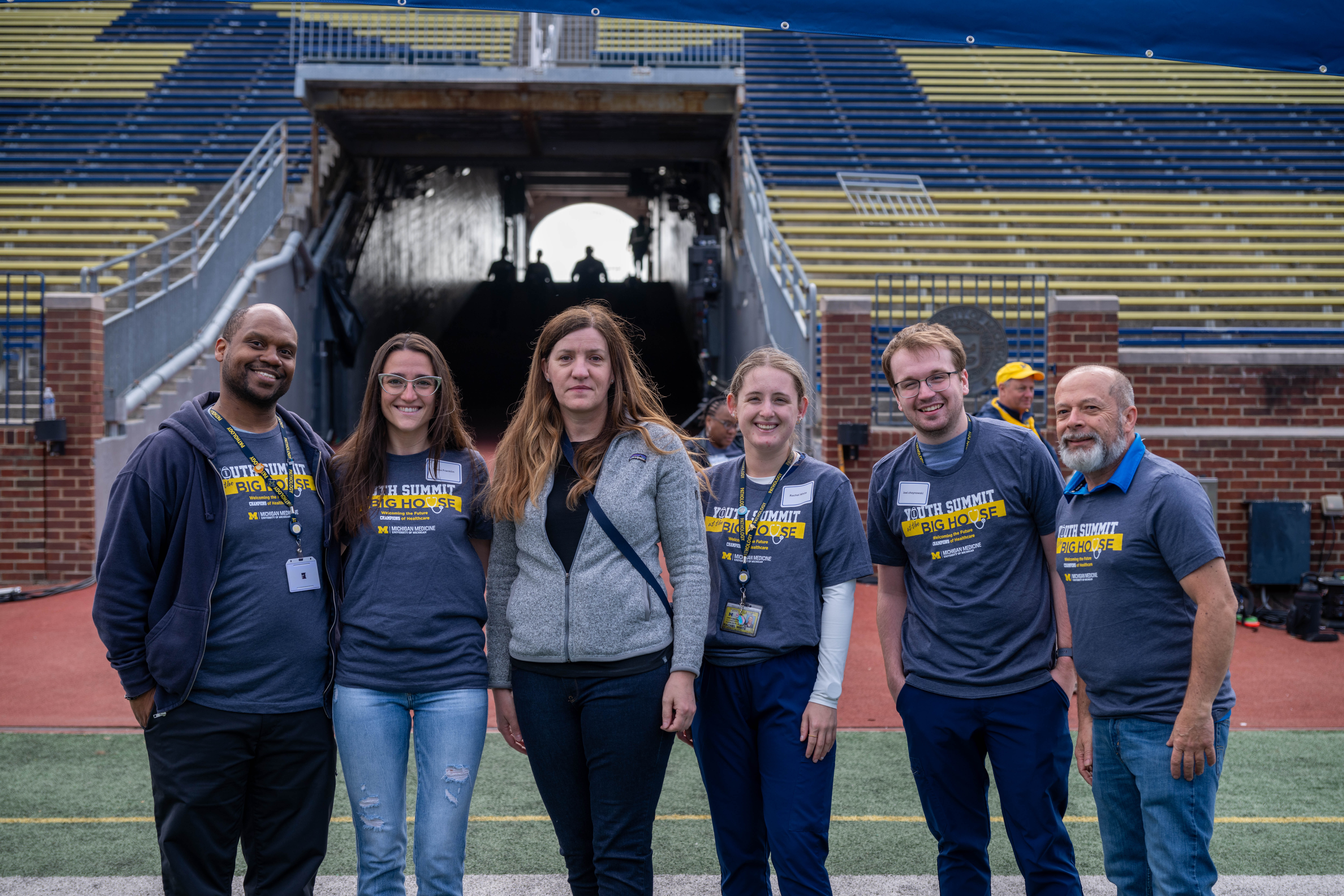 Department of Pathology Faculty and Staff pose for a photo at the Big House