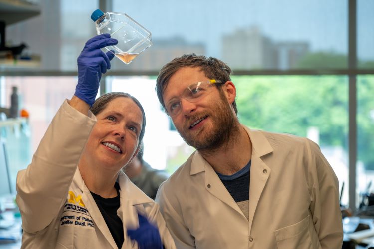 Dr. Jennifer Brazil mentors Research Lab Specialist Dylan Fink.
