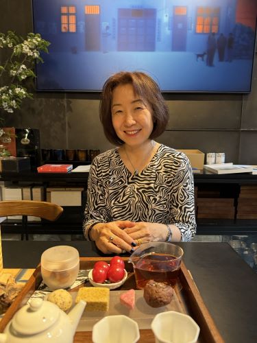Dr. Zhang enjoys lunch at a cafe outside the Forbidden City in Beijing.