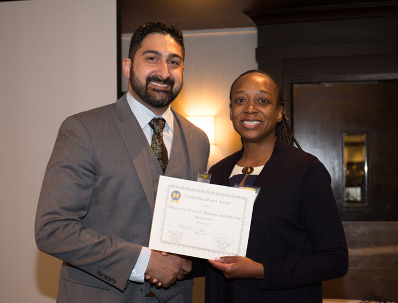 Milad Webb receiving award from Allecia Wilson