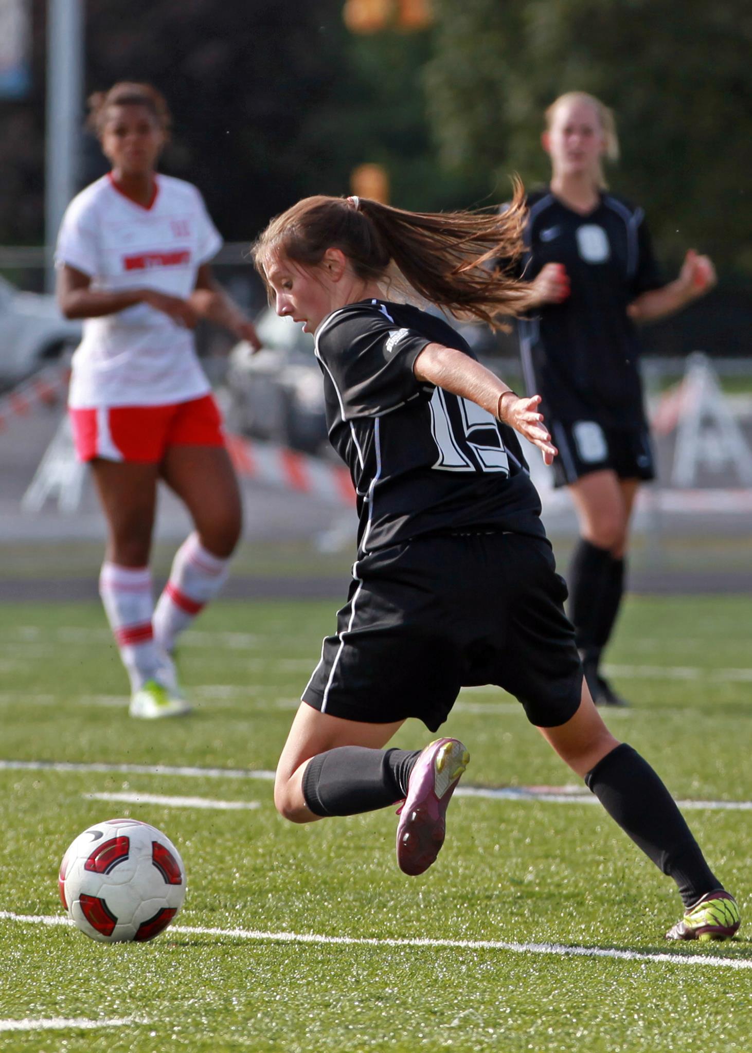 Julianne as a former collegiate soccer player.