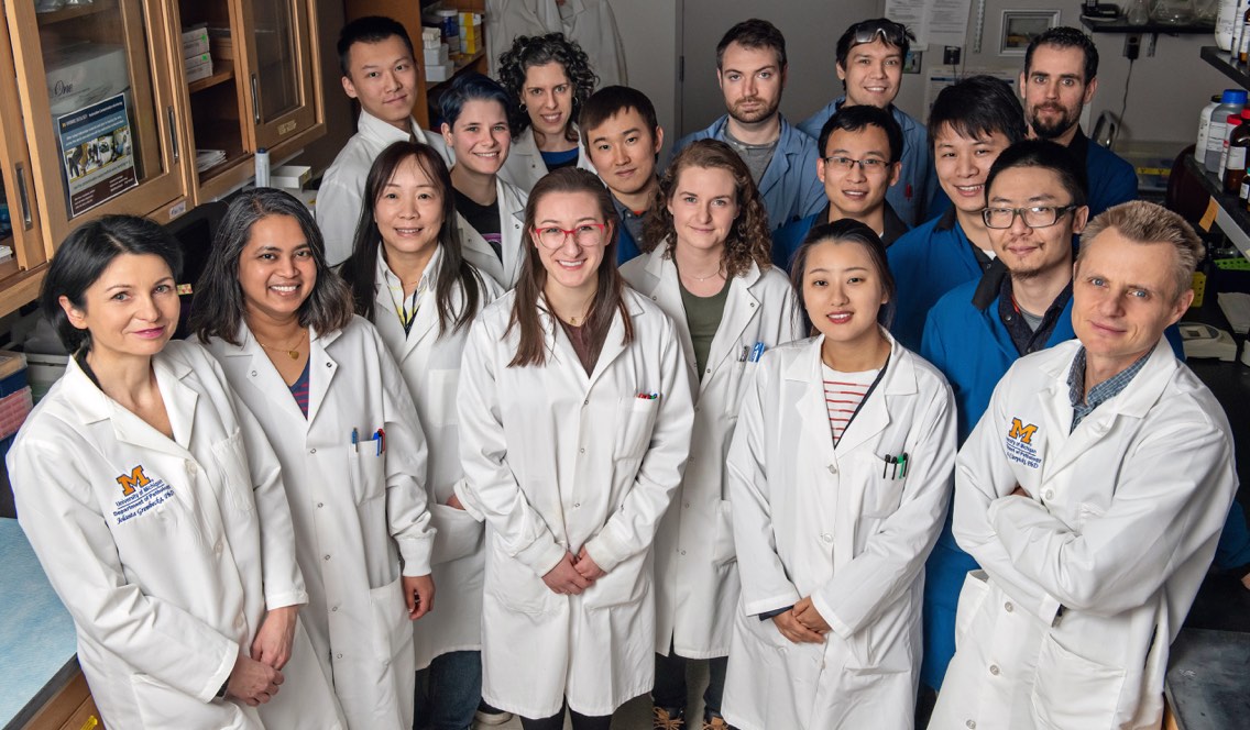 Jolanta Grembecka, PhD (far left), and Tomasz Cierpicki, PhD (far right), with their Lab Team.<br /><strong>Photo by</strong> Leisa Thompson